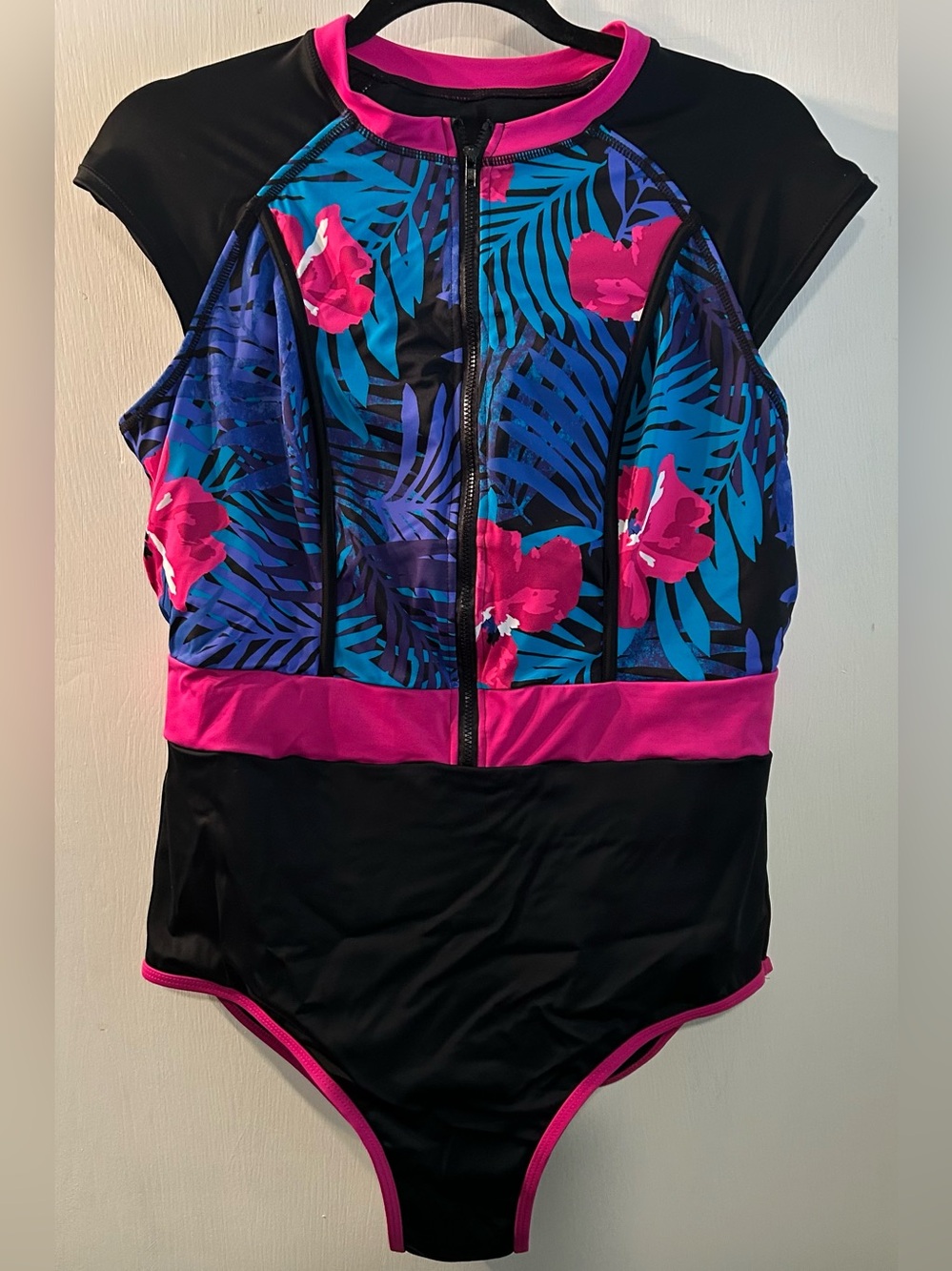 Body Glove women's zip-front paddle one-piece swimsuit, tropical floral design.